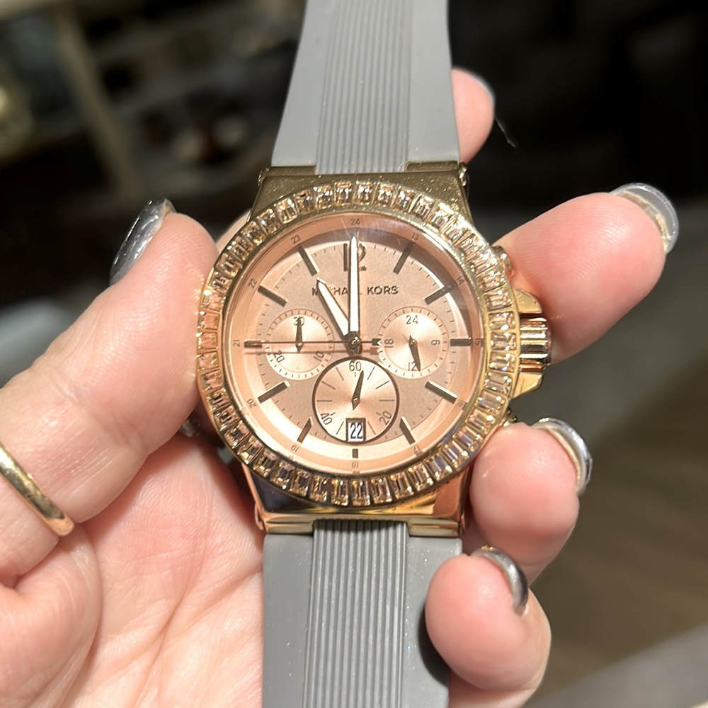Michael kors watch rose gold and gray the stone are pink  is a beautiful watch